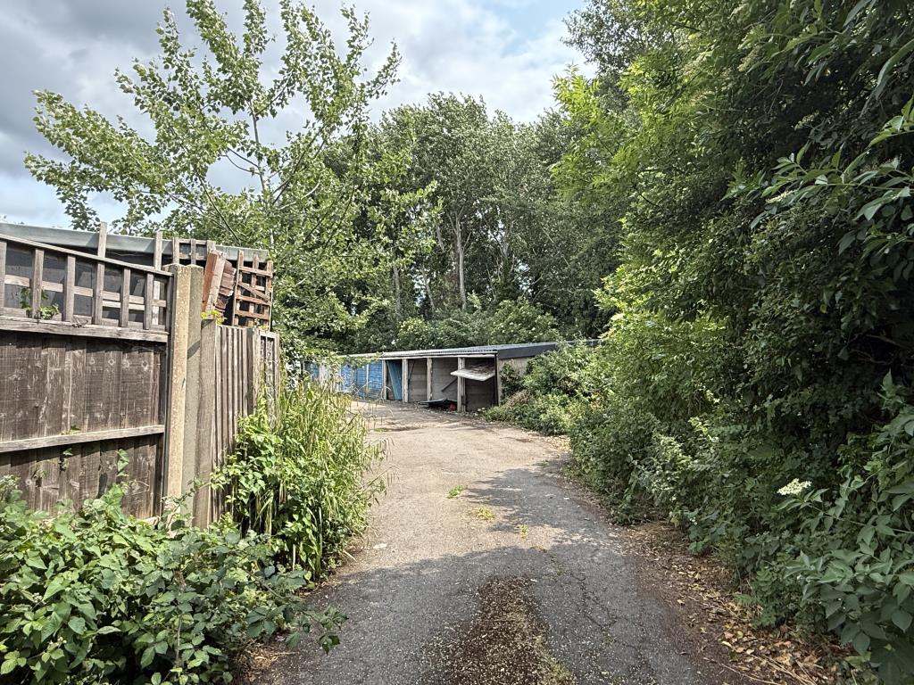 Lot: 5 - ELEVEN GARAGES WITH LAND IN RESIDENTIAL AREA - Driveway to Eleven Garages